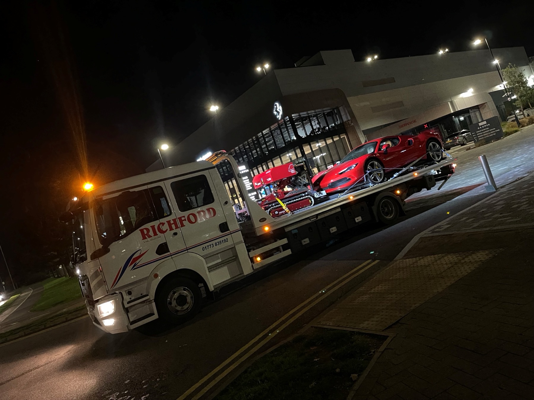 FMR recovery — Red ferrari on truck